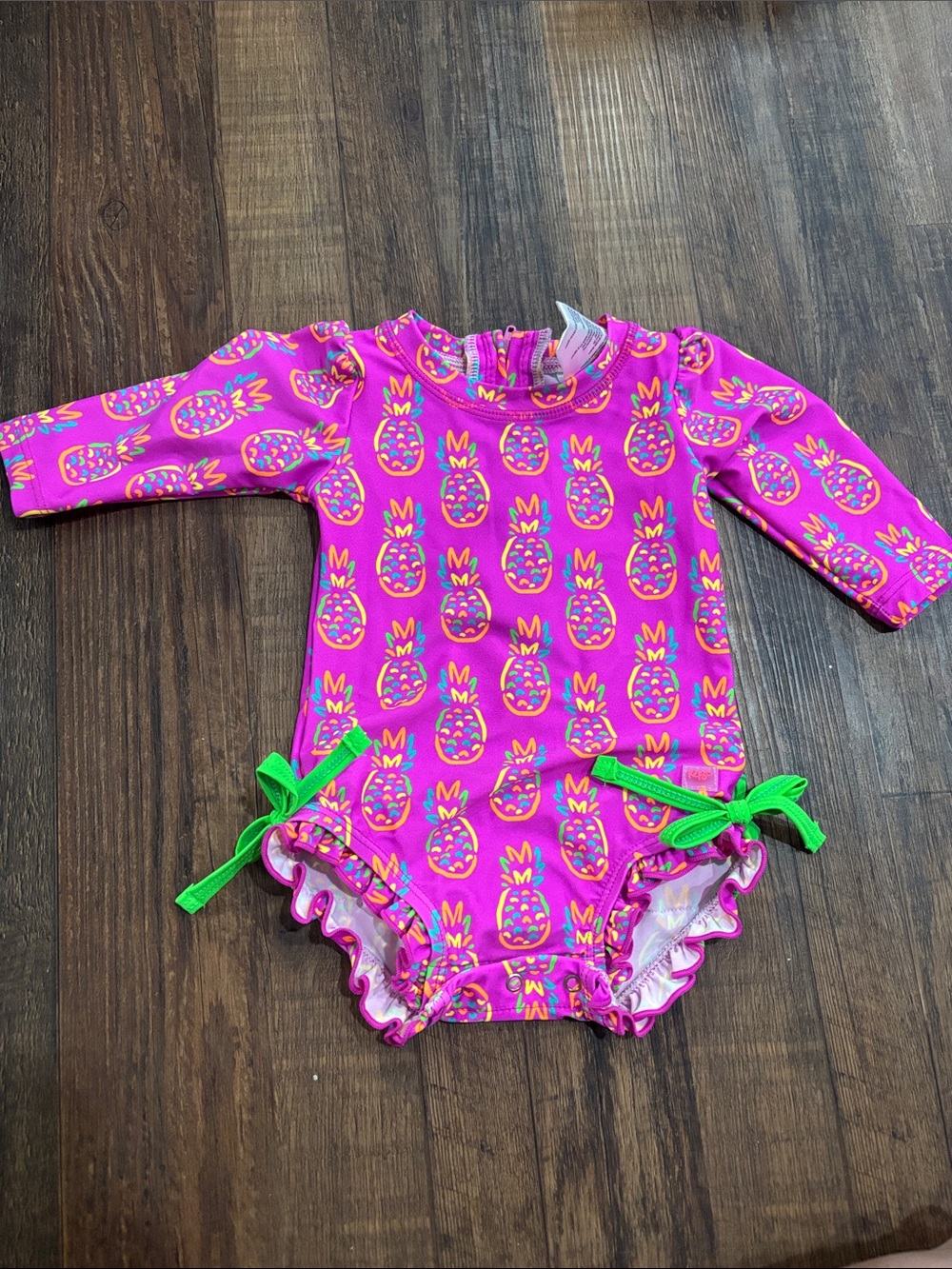 Ruffle Butts Pink Pineapple Long-Sleeve Rashguard One-Piece with Green Bows